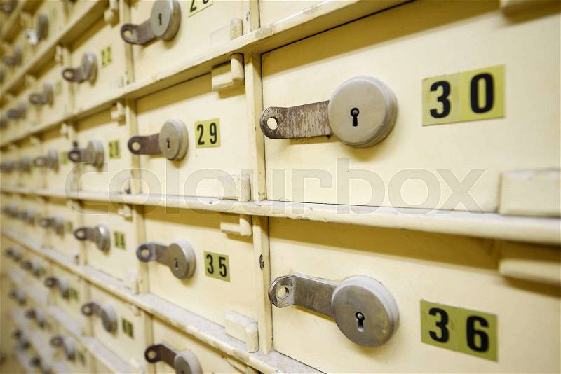 Closeup of a group of cells in an old safe bank, stock photo