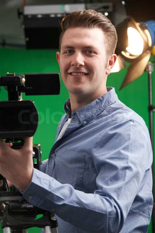 Portrait Of Cameraman Working In Television Studio, stock photo