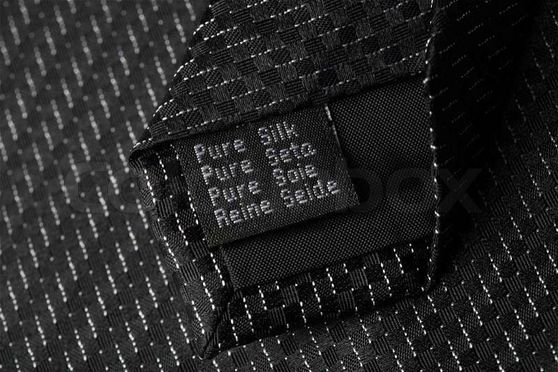 Pure silk label on a tie, stock photo
