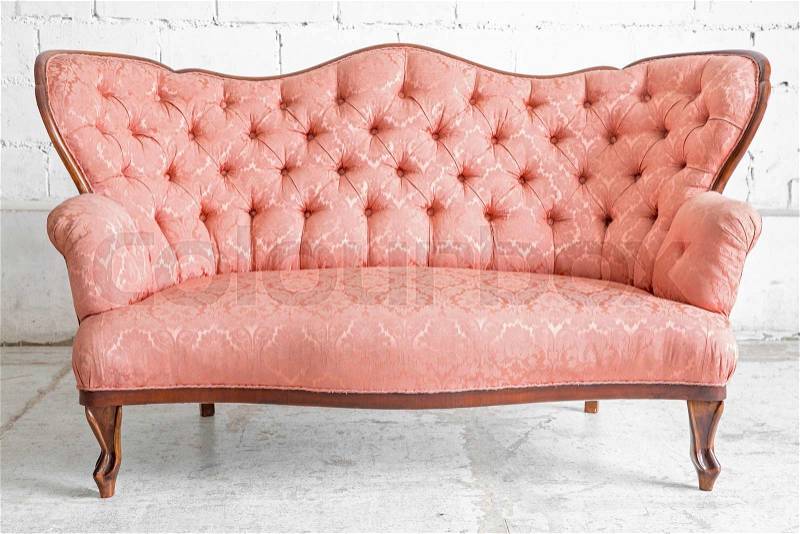 Pink classical style sofa couch in vintage room, stock photo