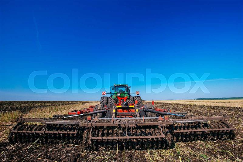 Working Harvesting Combine in the Field of Wheat, stock photo
