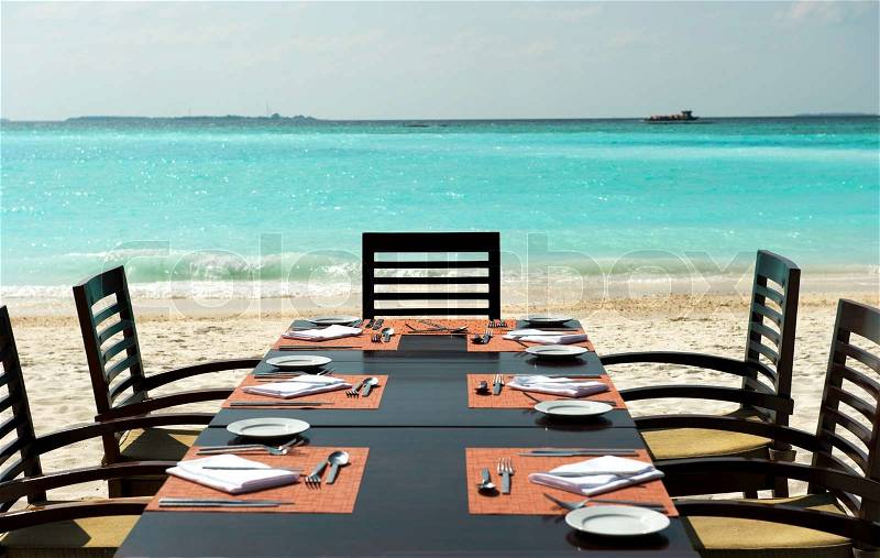 Dinner on exotic beach, stock photo