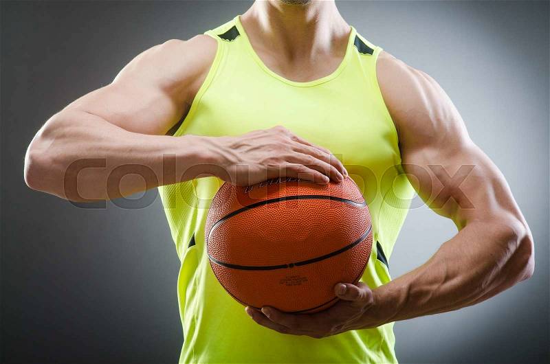 Muscular basketball in sports concept, stock photo