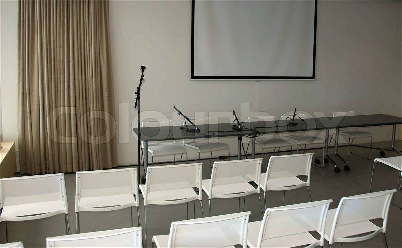 Room with chairs and microphone for instruction, stock photo
