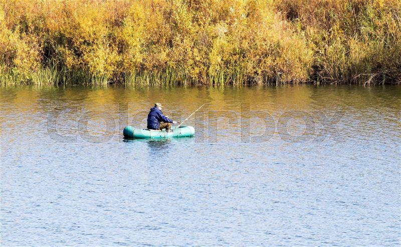 Rubber boat on the river, fishing, stock photo