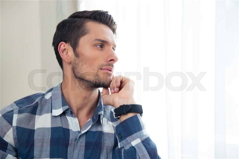 Portrait of a handsome casual man looking away , stock photo