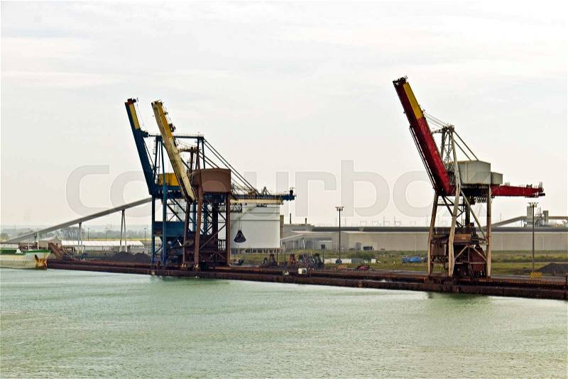 Loading cranes at sea port terminal, stock photo