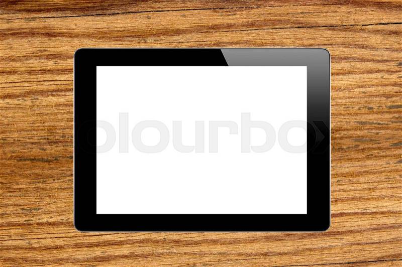 Black Touch Screen Tablet on wooden texture close-up, stock photo