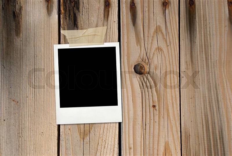 Grunge wood background with photo card, stock photo