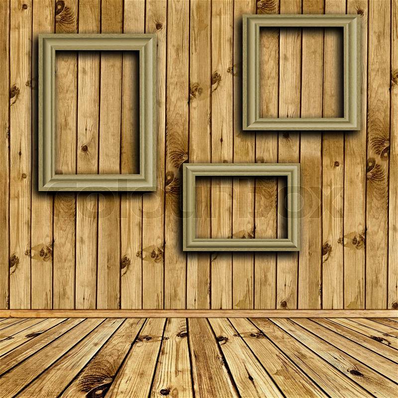 Photo of empty natural wooden interior with empty frames at wall, stock photo