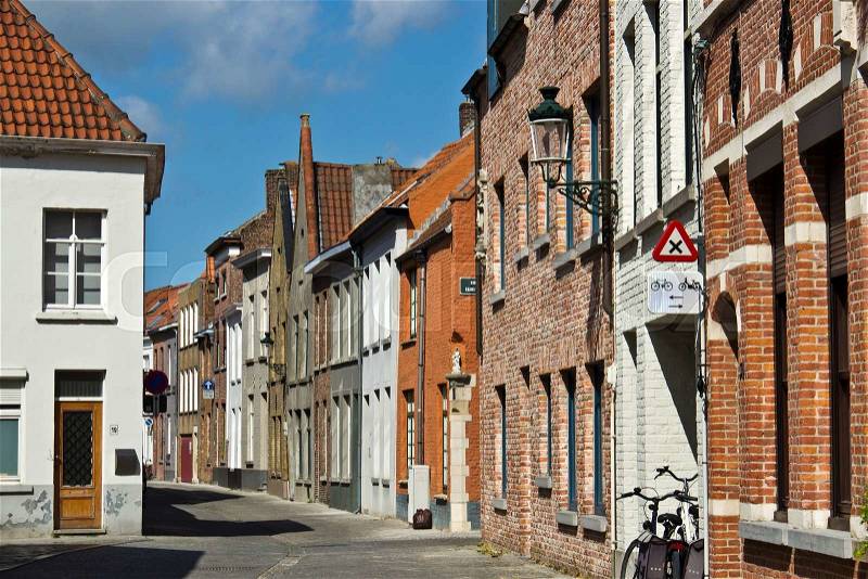 Tranquil street in european city of Bruges, Belgium, stock photo