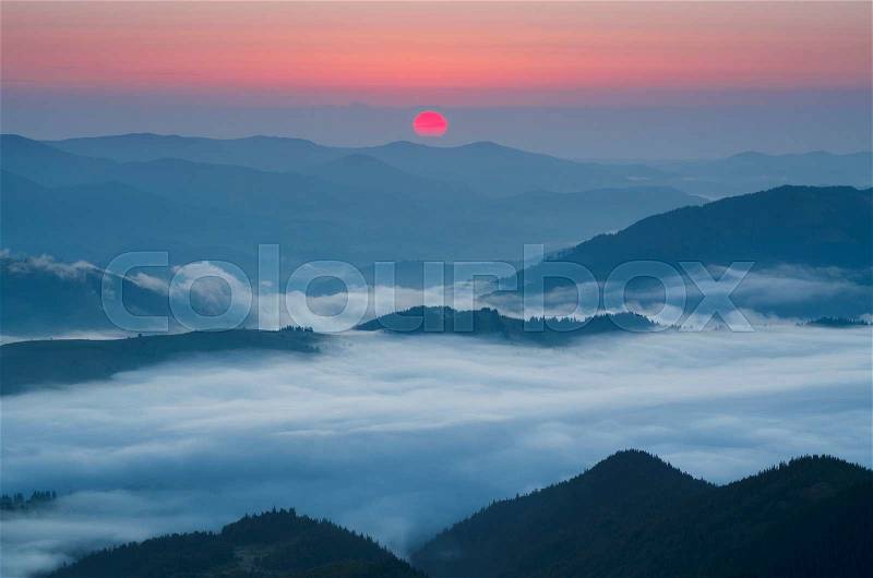 Carpathian mountains summer sunrise landscape with sun and foggy river, travel natural background, stock photo