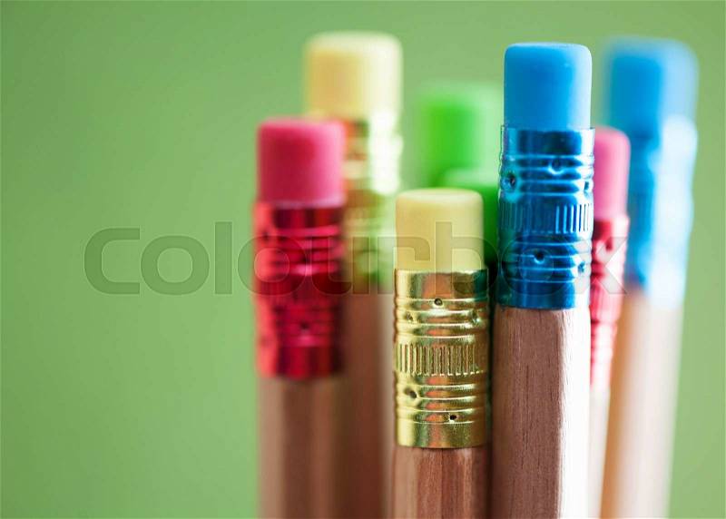 Row of color pencils on green background.art.Creativity, stock photo
