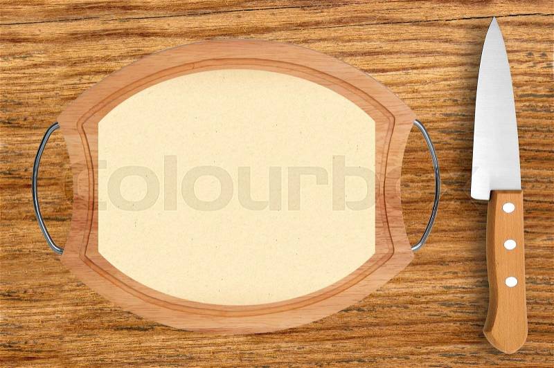 Cutting board with menu sheet of paper on rustic wooden table background, stock photo