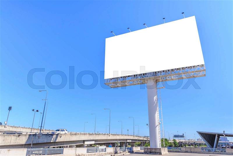 Blank billboard against blue sky for advertisement, stock photo