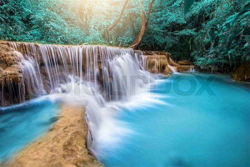 Beautiful waterfall in autumn forest, deep forest waterfall, Kanchanaburi province, Thailand, stock photo