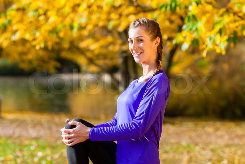 Woman doing sport outdoor in fall or autumn, stock photo
