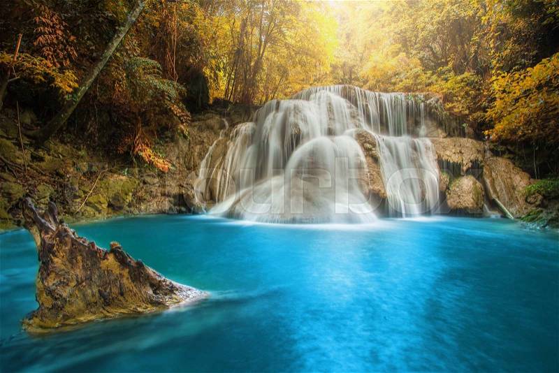 Beautiful waterfall in autumn forest, deep forest waterfall, Kanchanaburi province, Thailand, stock photo