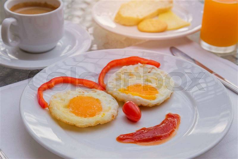Happy Face Frying Eggs breakfast with coffee, stock photo