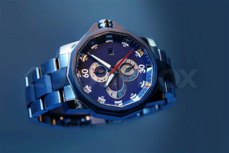 Swiss watches on blue background. Product photography, stock photo