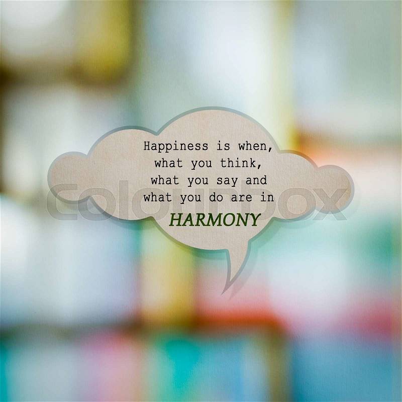 Meaningful quote on paper cloud with blurred colorful background, Harmony, stock photo