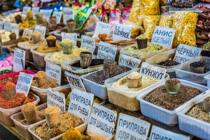 Vivid oriental central asian market with bags full of various spices in Osh bazar in Bishkek, Kyrgyzstan, stock photo
