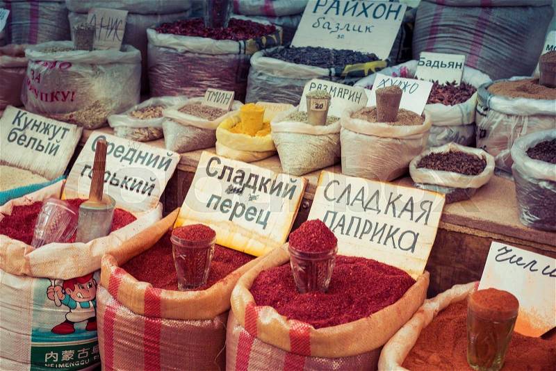 Beautiful vivid oriental market with bags full of various spices in Osh bazaar in Bishkek, Kyrgyzstan, stock photo