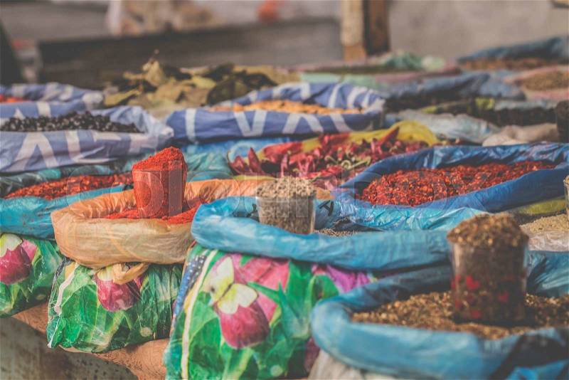 Vivid oriental central asian market with bags full of various spices in Osh bazar in Bishkek, Kyrgyzstan, stock photo