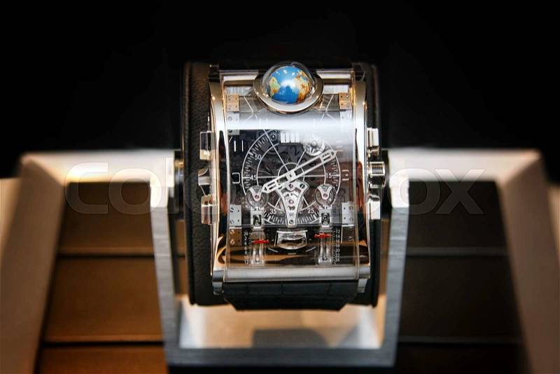Swiss watches on blurred background of watch box. Product photography. Product photography, stock photo