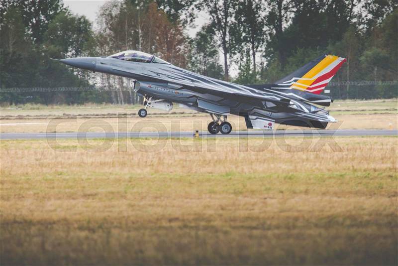RADOM, POLAND - AUGUST 23: Belgian Air Force F-16 makes its show during Air Show Radom on August 23, 2015, stock photo