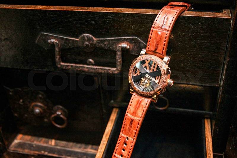 Swiss watches hanging on the desk drawer. Luxury watch men or women accessories, stock photo