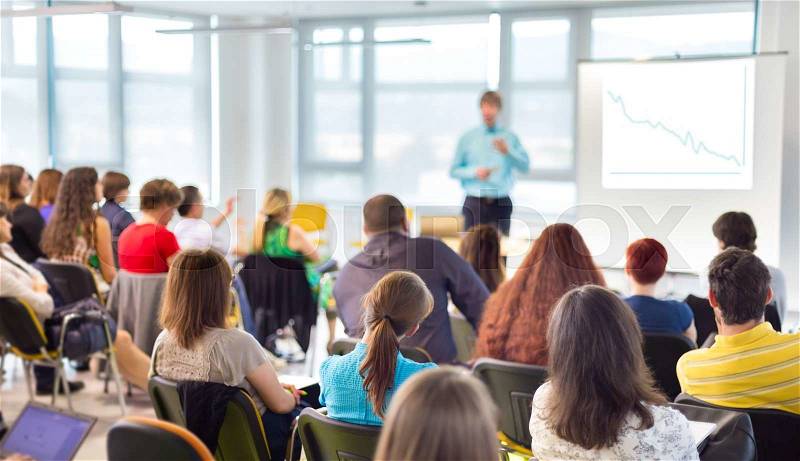 Speakers Giving a Talk at Business Meeting. Audience in the conference hall. Business and Entrepreneurship concept, stock photo