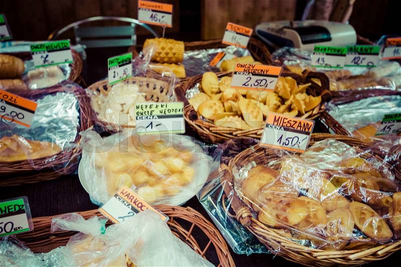 Traditional polish smoked cheese oscypek on outdoor market in Zakopane , stock photo