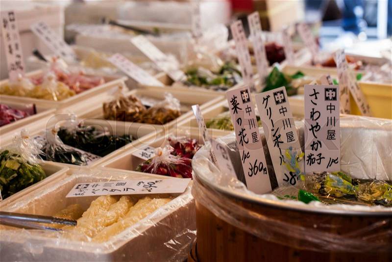 Exotic foods on display in traditional market in Japan, stock photo