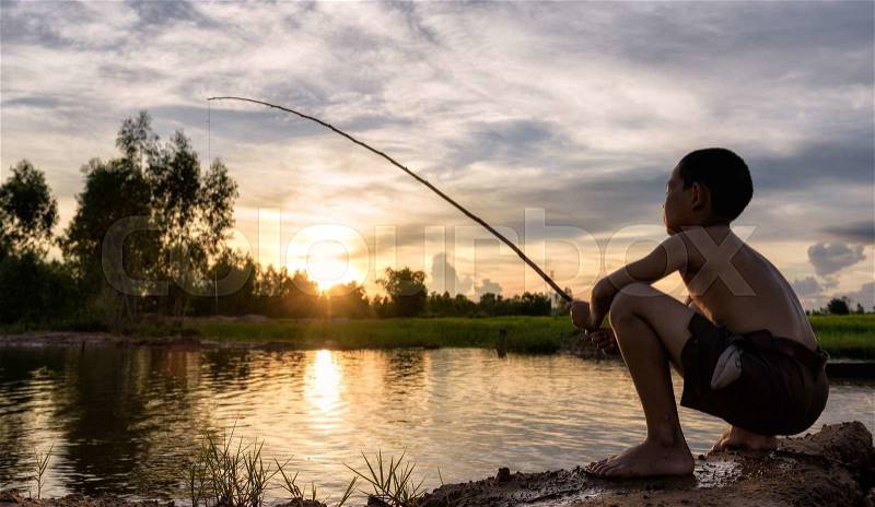 Boy fishing, stock photo