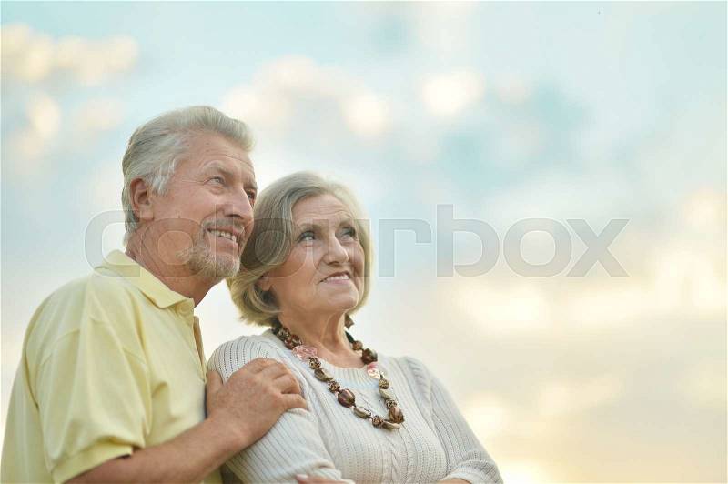 Portrait of beautiful senior couple outdoor in summer park, stock photo
