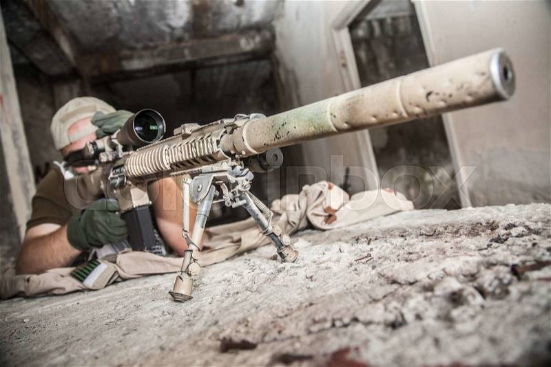 Navy Seal Sniper with rifle in action , stock photo