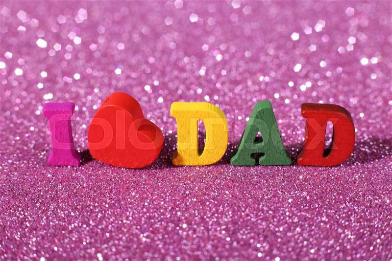 Colorful word I love dad standing on the glittering background, stock photo