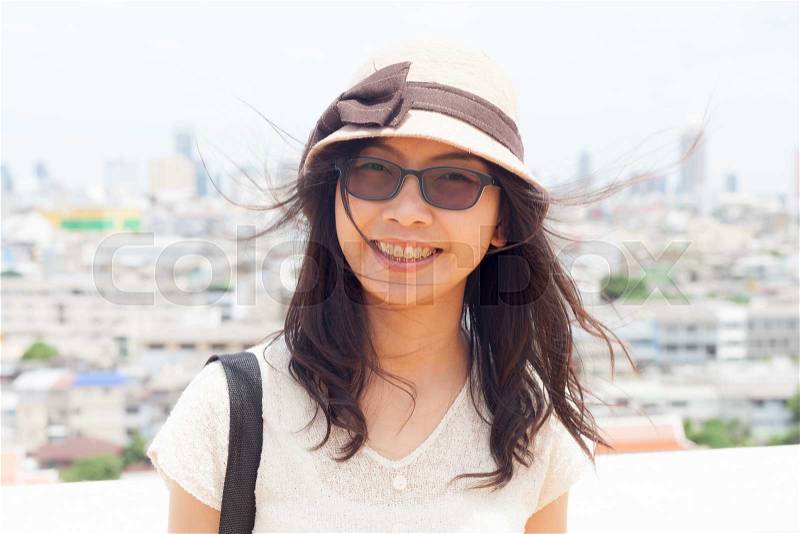 Joy and smile asia woman.wear eyeglasses and hat.smile and relax, stock photo