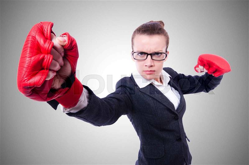 Woman with boxing gloves on white, stock photo
