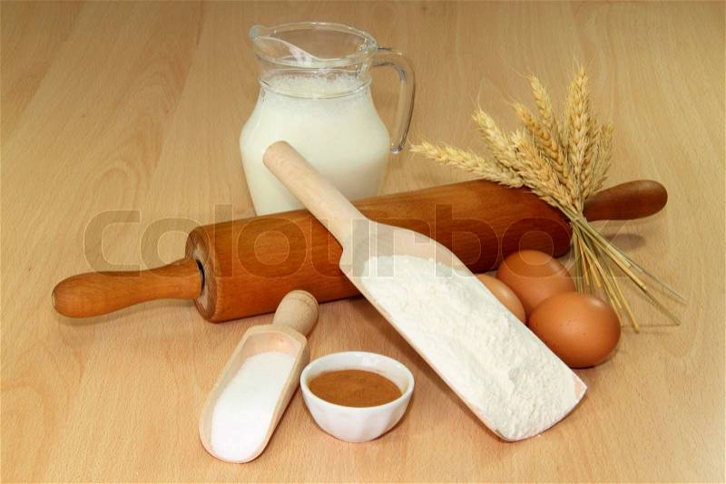 Baking ingredients on a brown kitchen board, stock photo