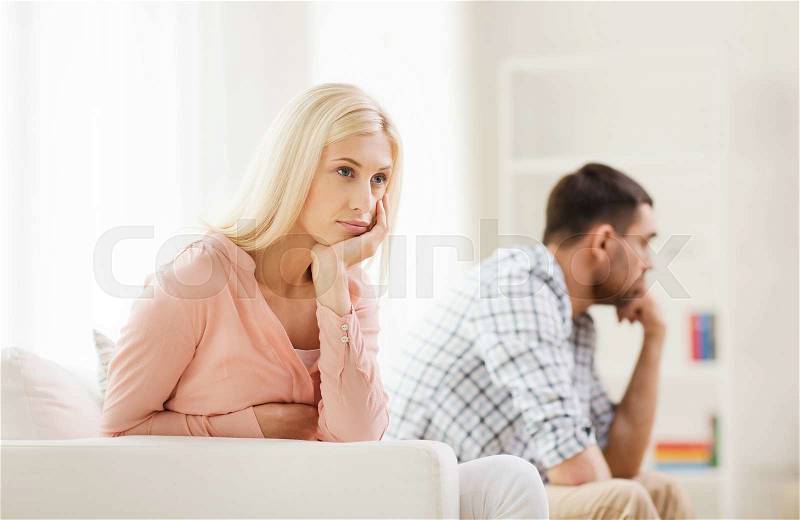 People, relationship difficulties, conflict and family concept - unhappy couple having argument at home, stock photo