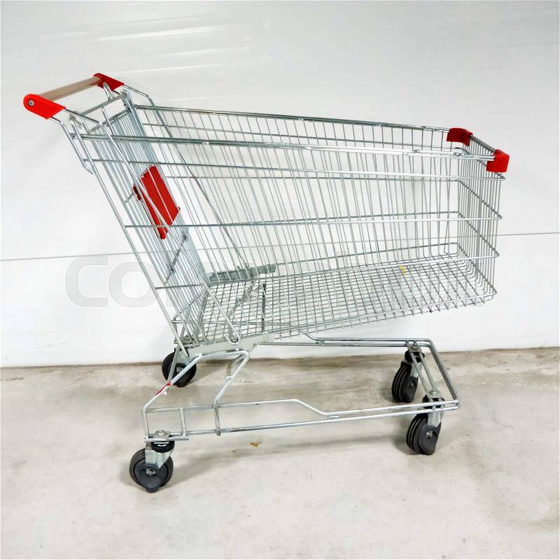 Empty shopping cart- trolley in the supermarket, stock photo