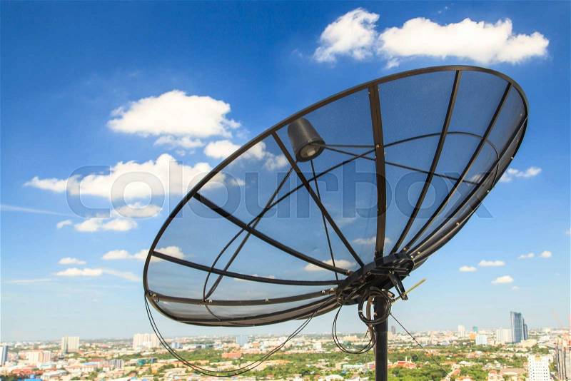Satellite dish on blue sky, stock photo