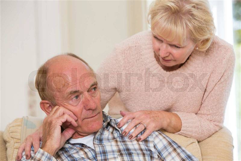 Woman Comforting Senior Man With Depression, stock photo