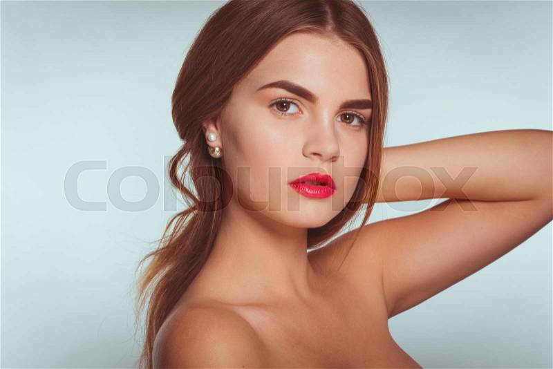 Portrait of attractive caucasian young girl with perfect skin and shiny hair isolated on white in studio, split tonning, stock photo