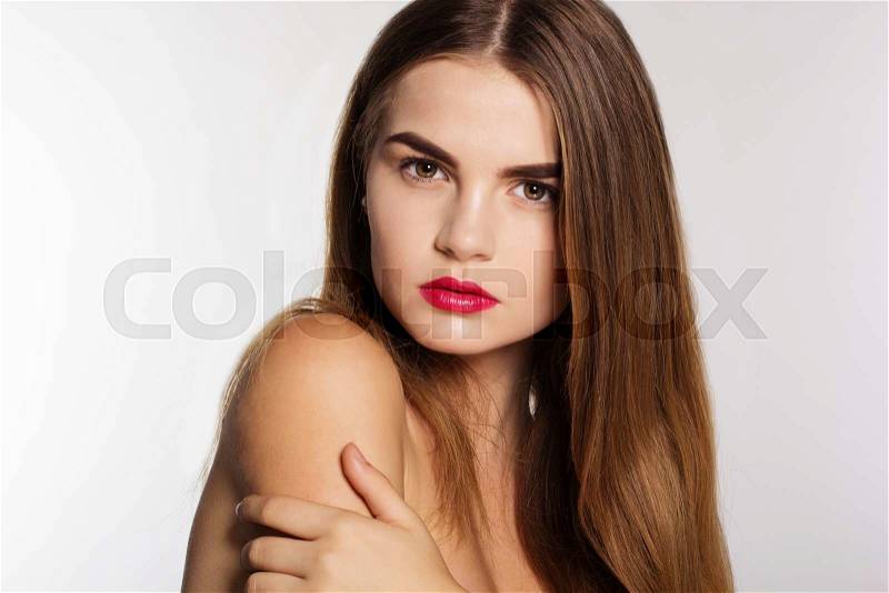 Portrait of attractive caucasian young girl with perfect skin and shiny hair isolated on white in studio , stock photo