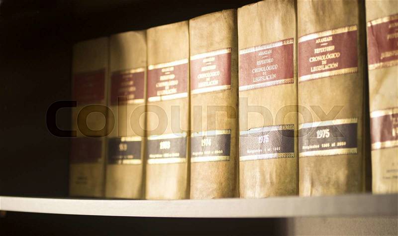 Old legal books Spanish barristers law reports in Spain on bookshelf in real life solicitors law attorneys office library, stock photo