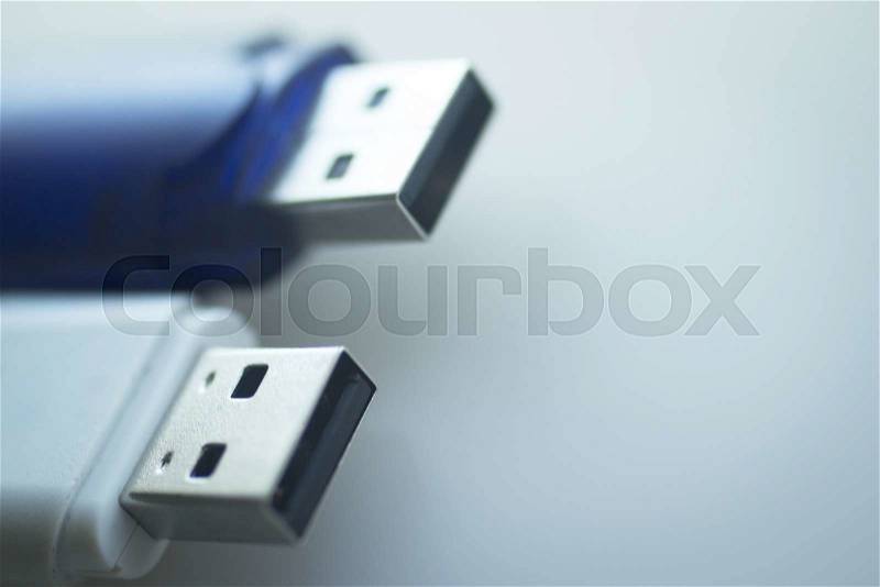 Two USB 3 flash drive III pendrive IT PC memory storage dongle plug socket close-up color artistic photo in blue tones, stock photo