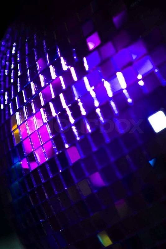 Disco ball in Ibiza house techno dance music wedding reception party in nightclub with colored lighting effect disco lights, stock photo